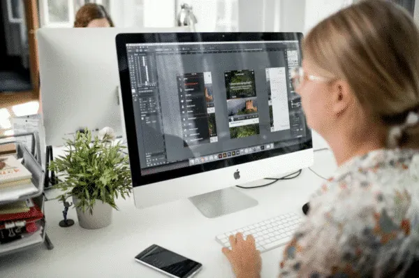 Appsfactory designers collaborating on digital graphics projects to improve creative output