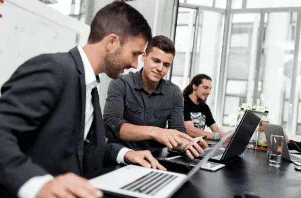 Appsfactory team collaborating in a modern workspace to enhance project innovation and productivity